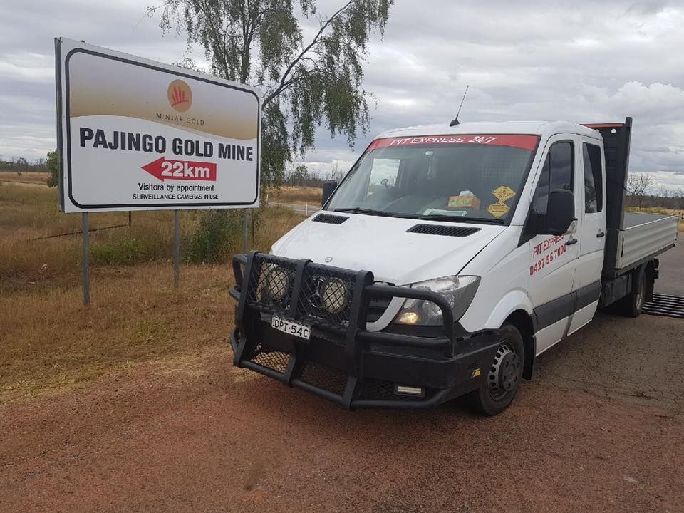 White Van is Parked in Front of a Sign That Says Pajingo Gold Mine — Pit Express in Singleton, NSW
