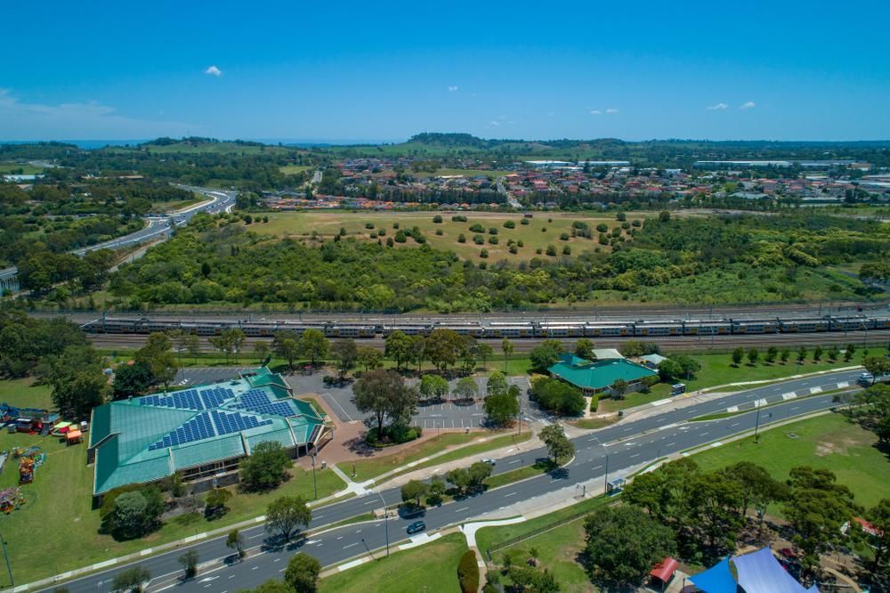 An Aerial View of a Park With a Train Going by — Pit Express in Wyong, NSW
