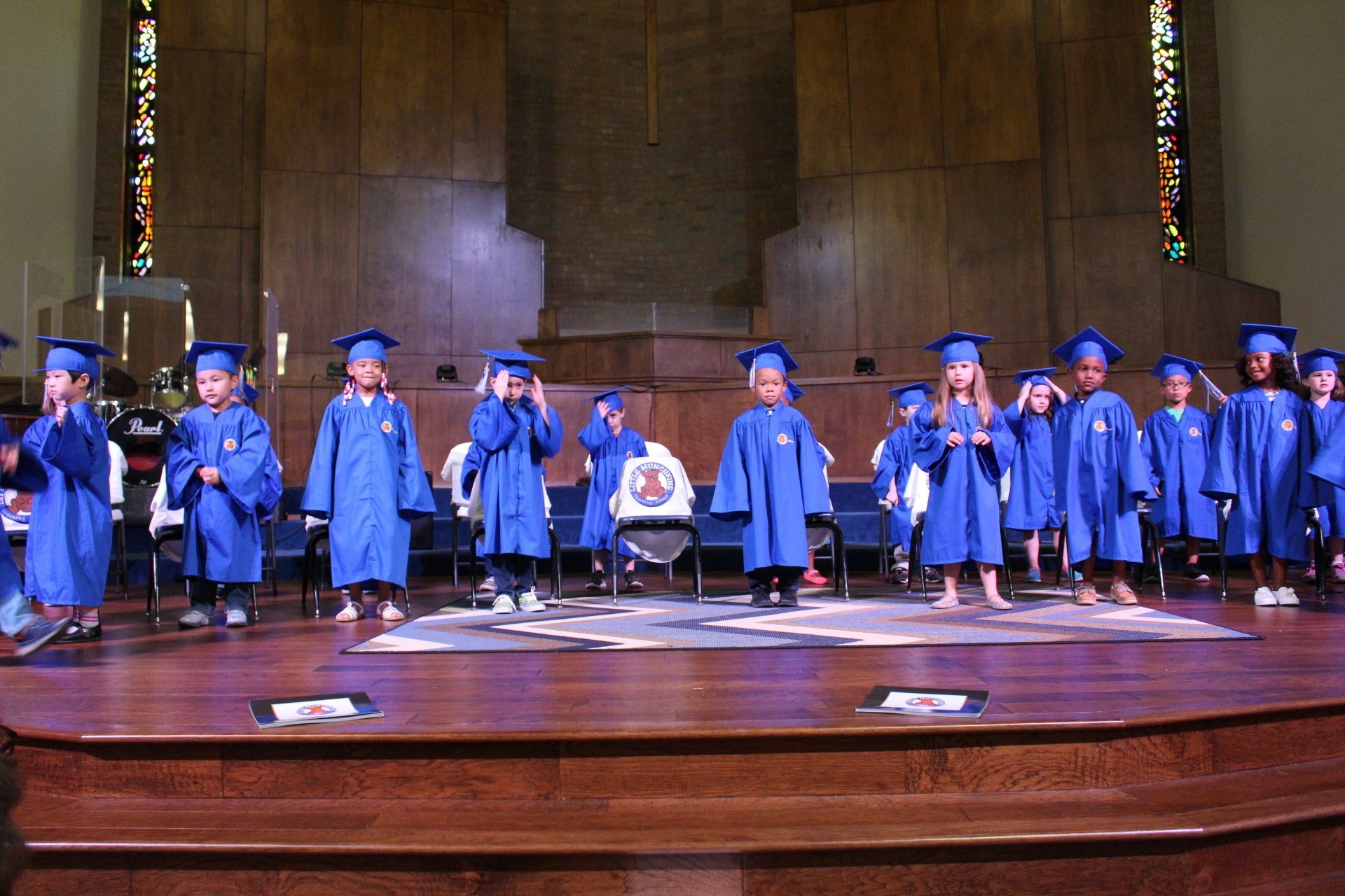 Graduation Ceremony of Children on Stage — Austin, TX — Little Munchkins Learning Center
