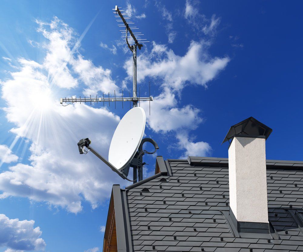 Satellite Dish And TV Antenna On Blue Sky — TV & Internet Services in Ballina, NSW