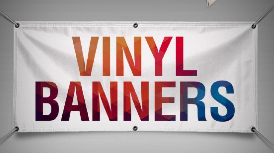White vinyl banner with “VINYL BANNERS” in colorful gradient text, grommets and ropes.