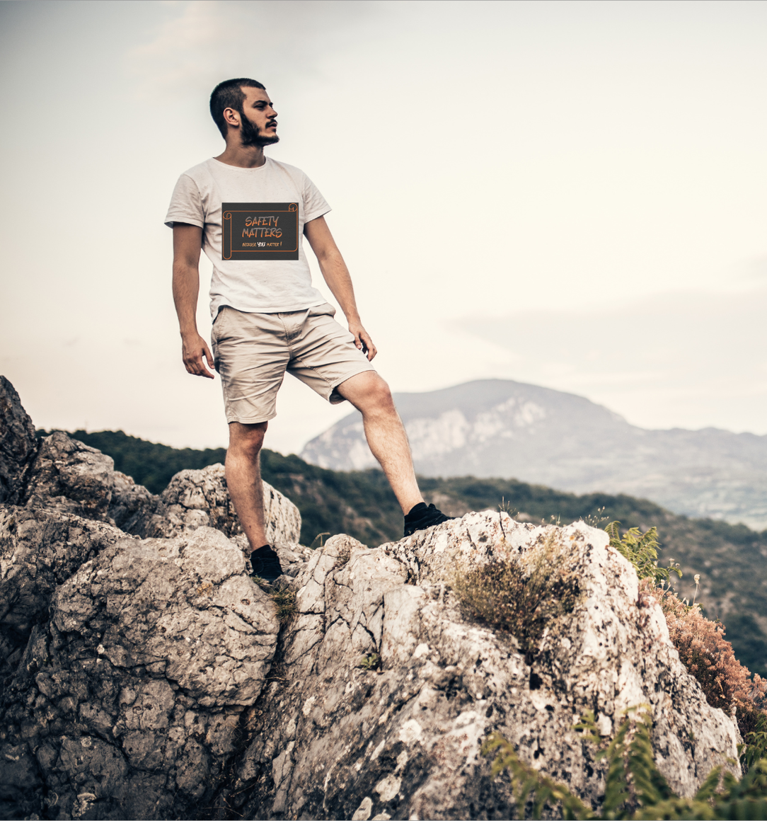 Man wearing Safety Matters shirt Man on mountain with shirt that says