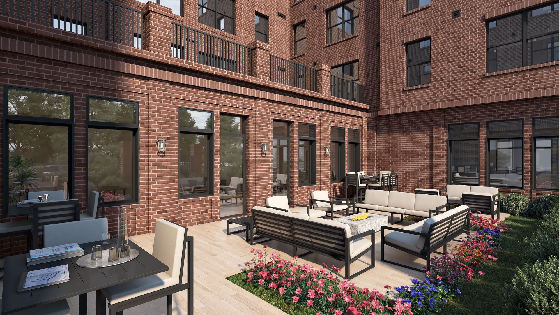 Exterior patio with brick building, outdoor seating, and small garden.