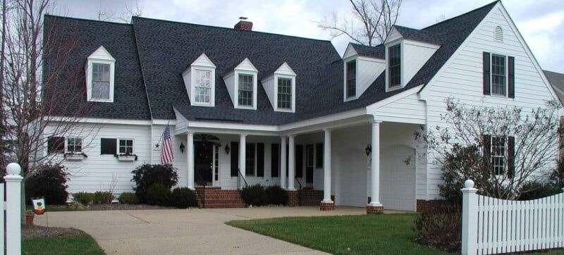 White Painted House with American Flag — Chesapeake, VA — All In Builders