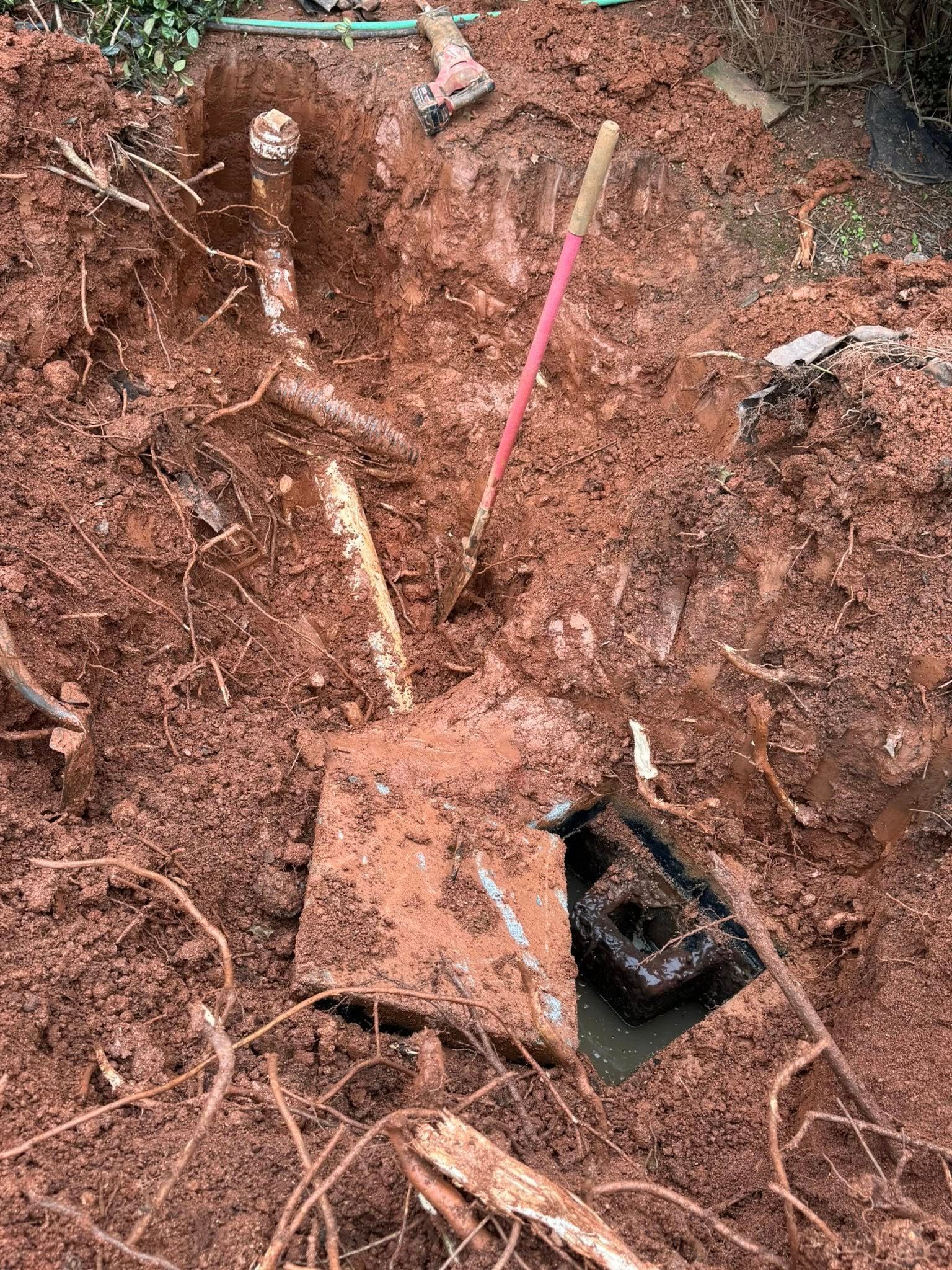 A shovel is sitting in the middle of a pile of dirt.