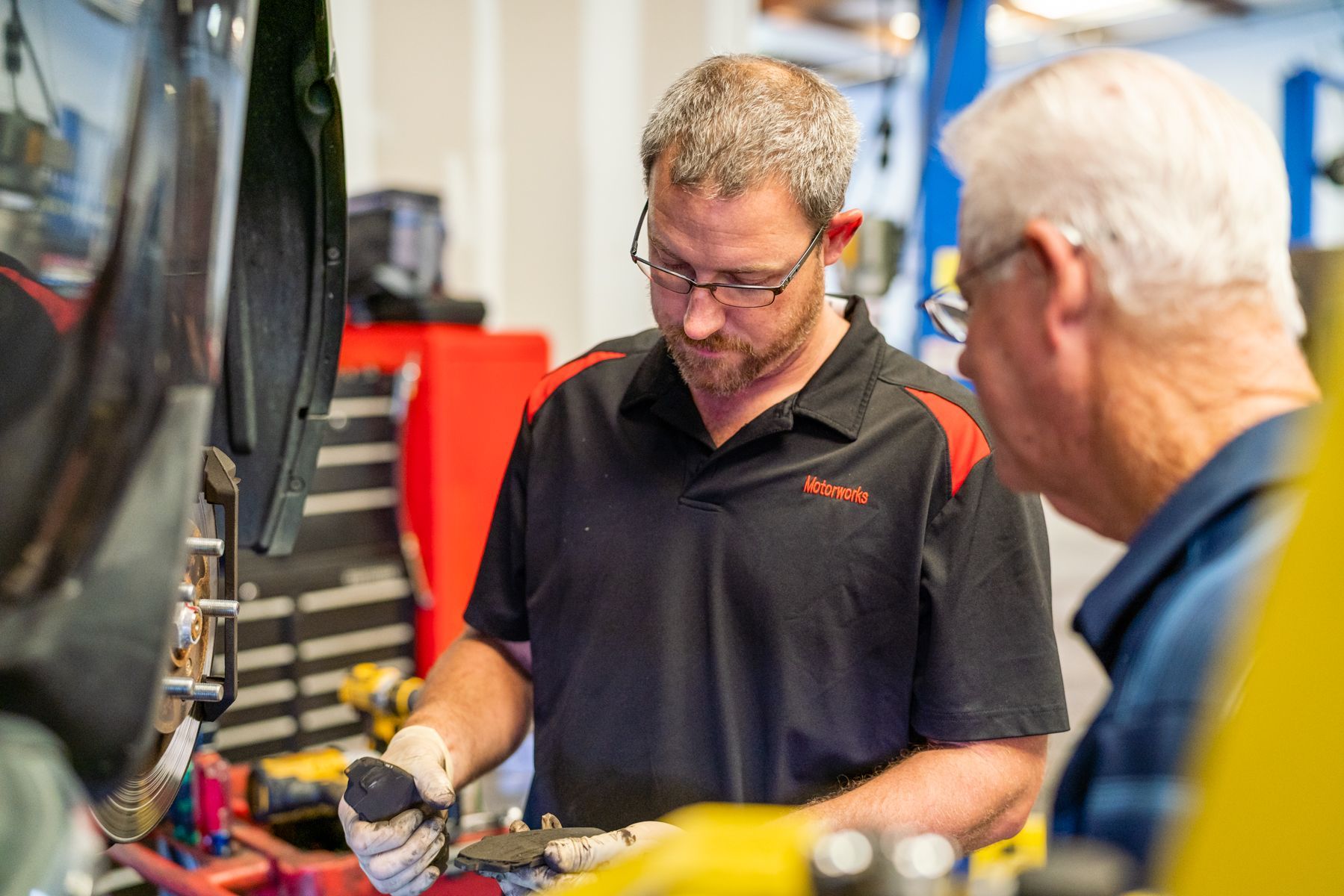 Technician Explaining Engine Service To Customer | Motorworks of Florida