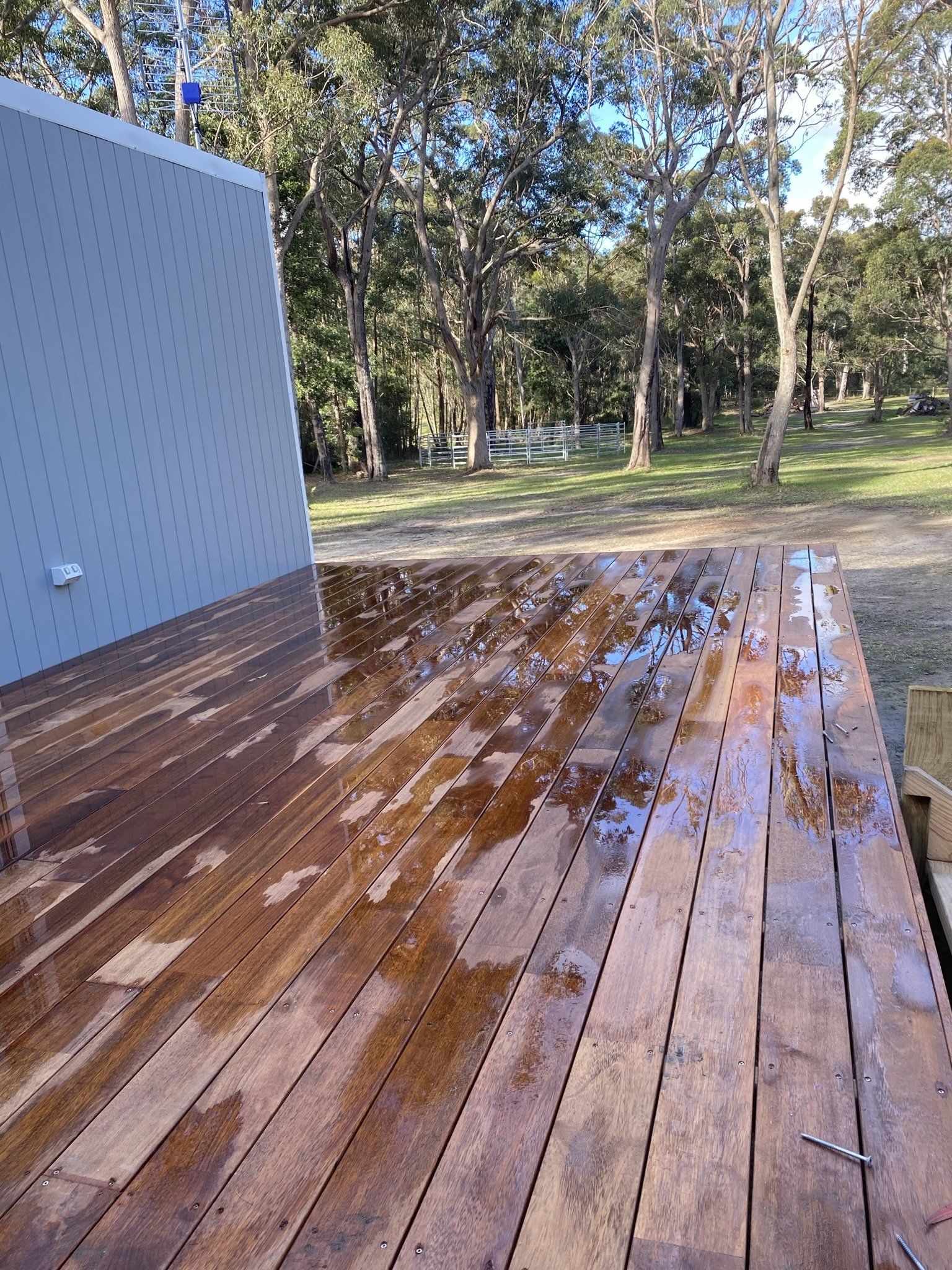 Freshly Washed Timber Deck Adorning a Residential Property — Pergolas in Nowra, NSW
