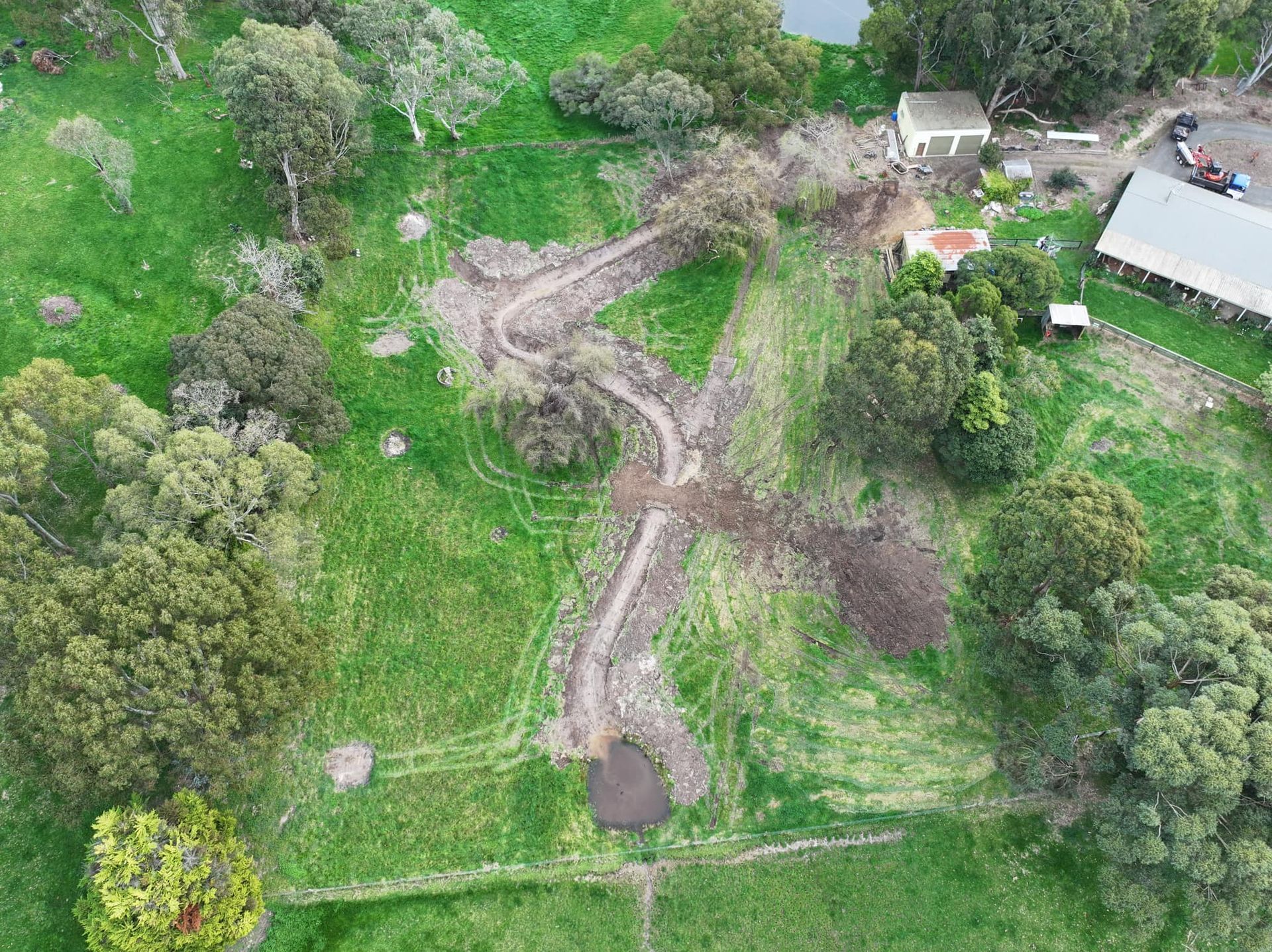 A metal structure is sitting in the middle of a field