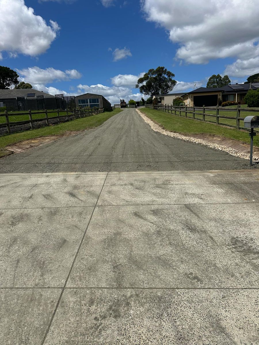 There is a mailbox on the side of the road.