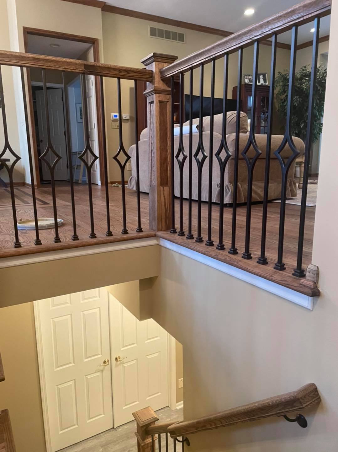 Residential interior walls professionally painted tan with white trim