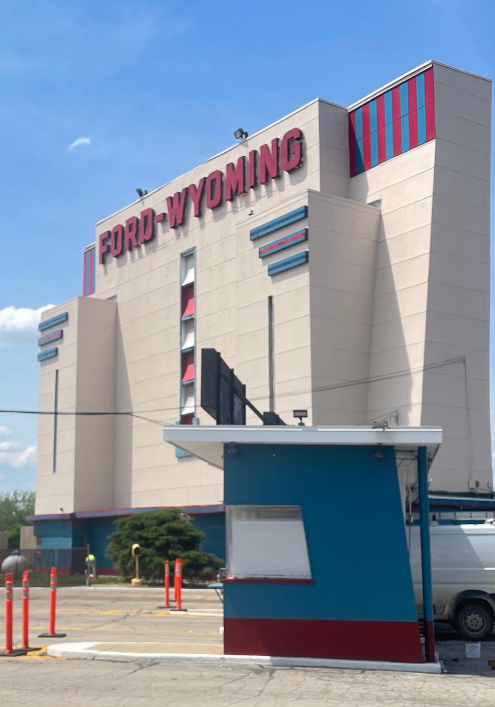 The Ford-Wyoming drive-in movie theater painted tan, red & blue by an expert painting company 
