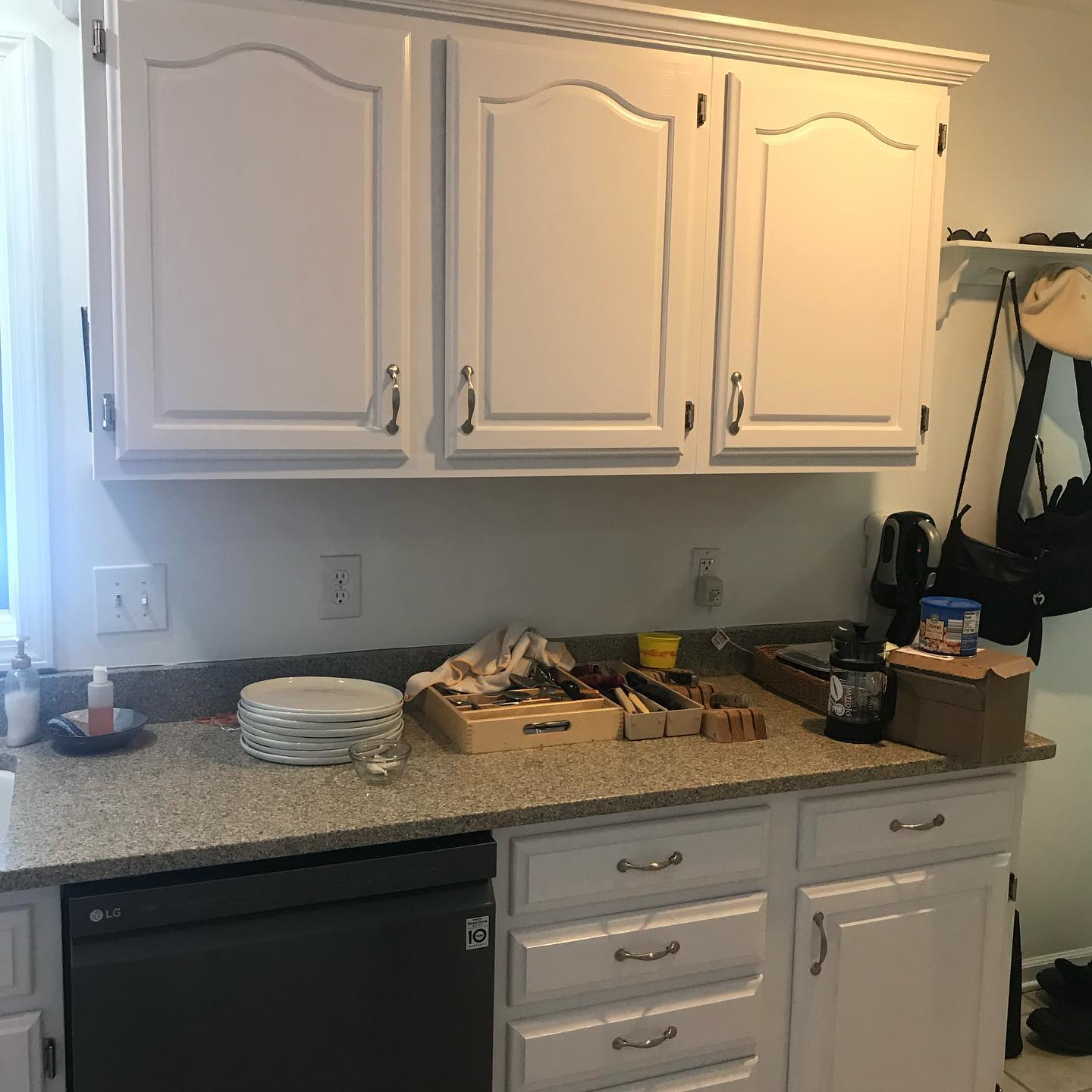 Kitchen cabinets painted white by a custom cabinet painter 