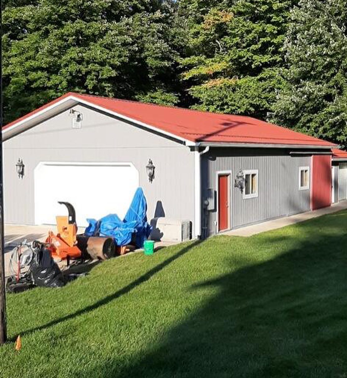 A garage with re-painted siding by a painting contractor in Michigan