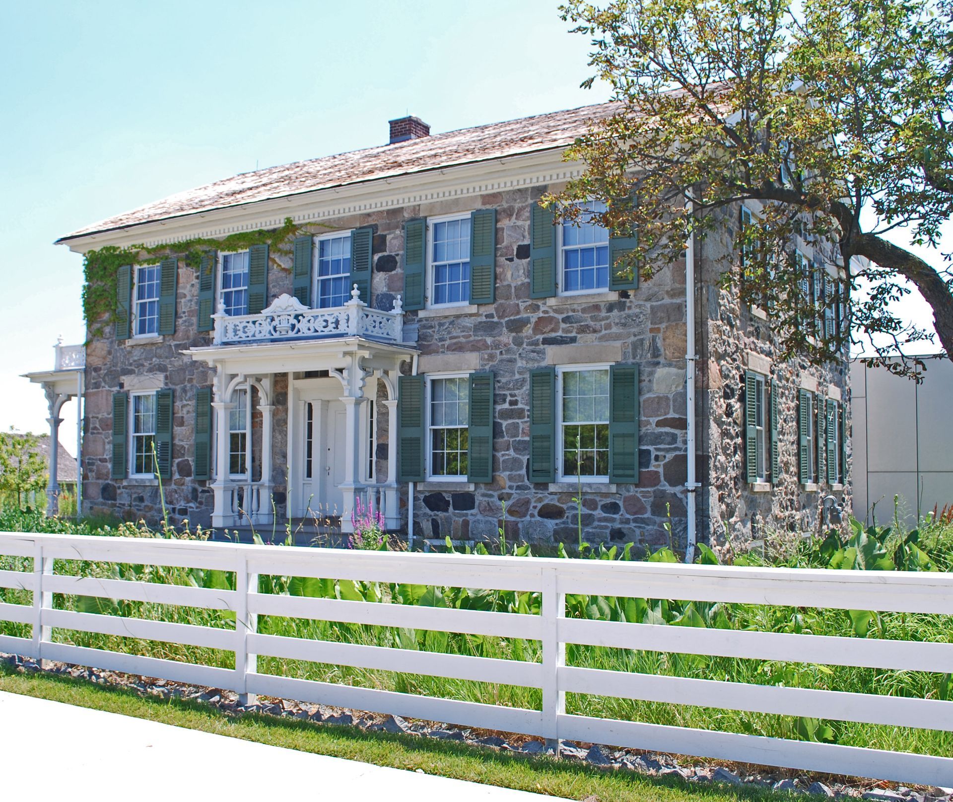 brooks farmhouse with green exterior painted shutters