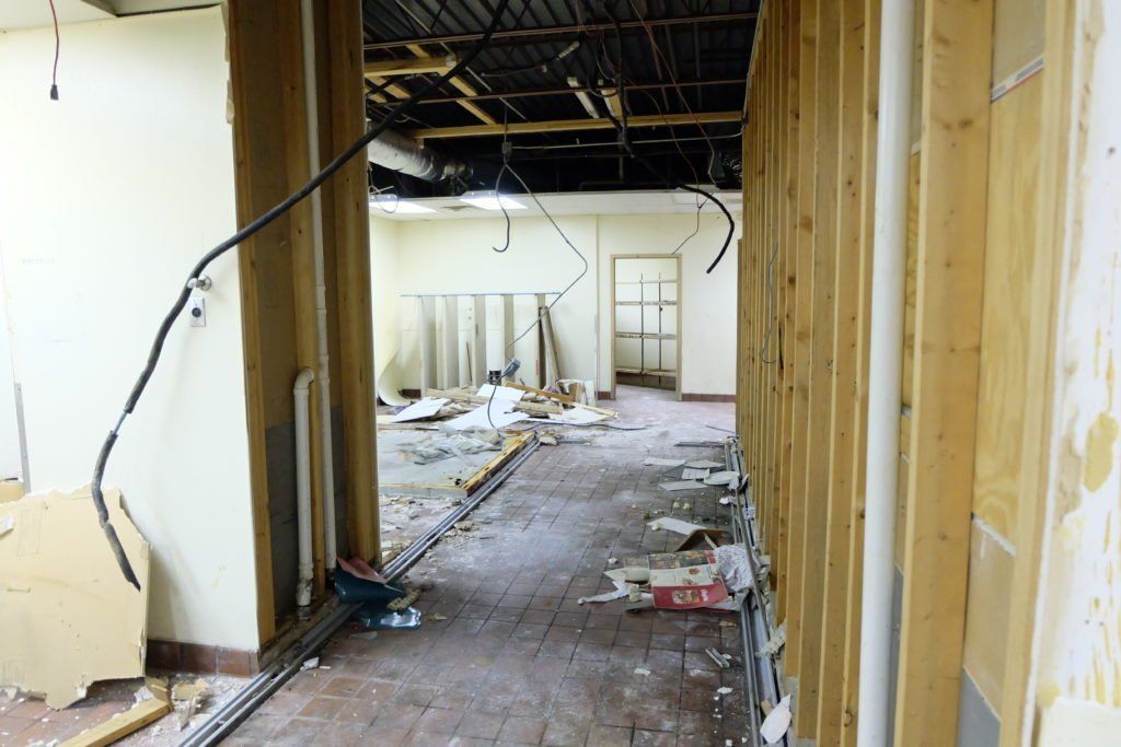 A hallway in a building that is being remodeled