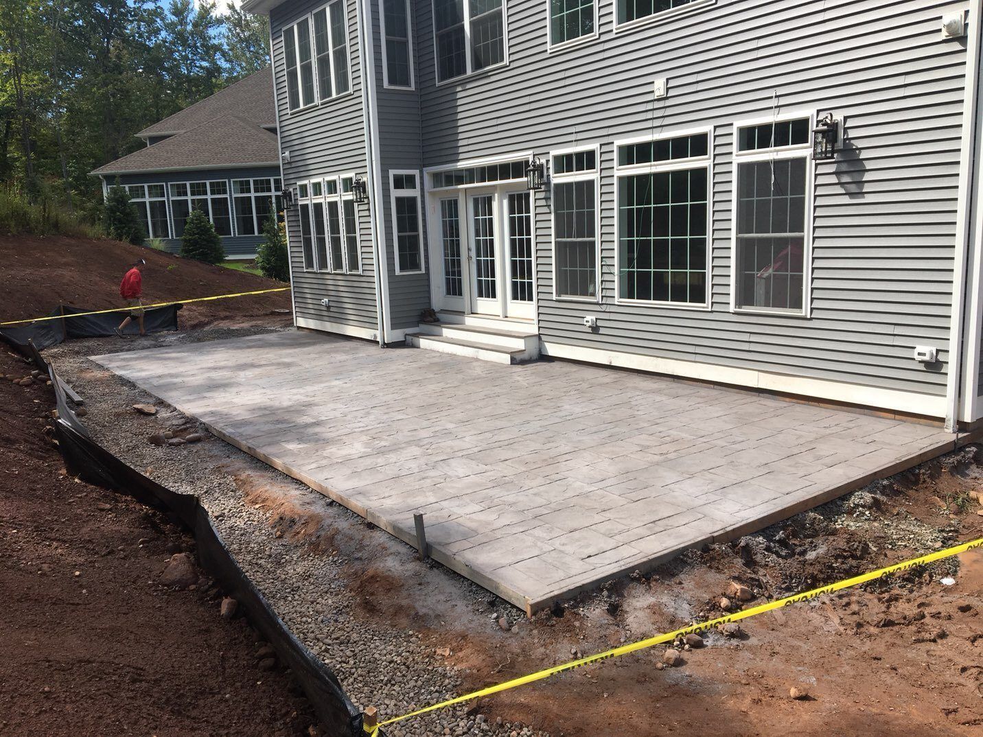 A large house with a large patio in front of it.