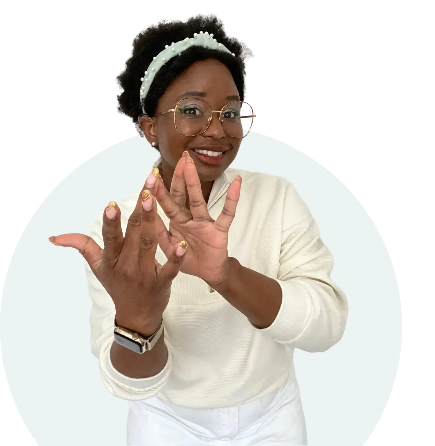 A woman wearing glasses and a headband is signing.