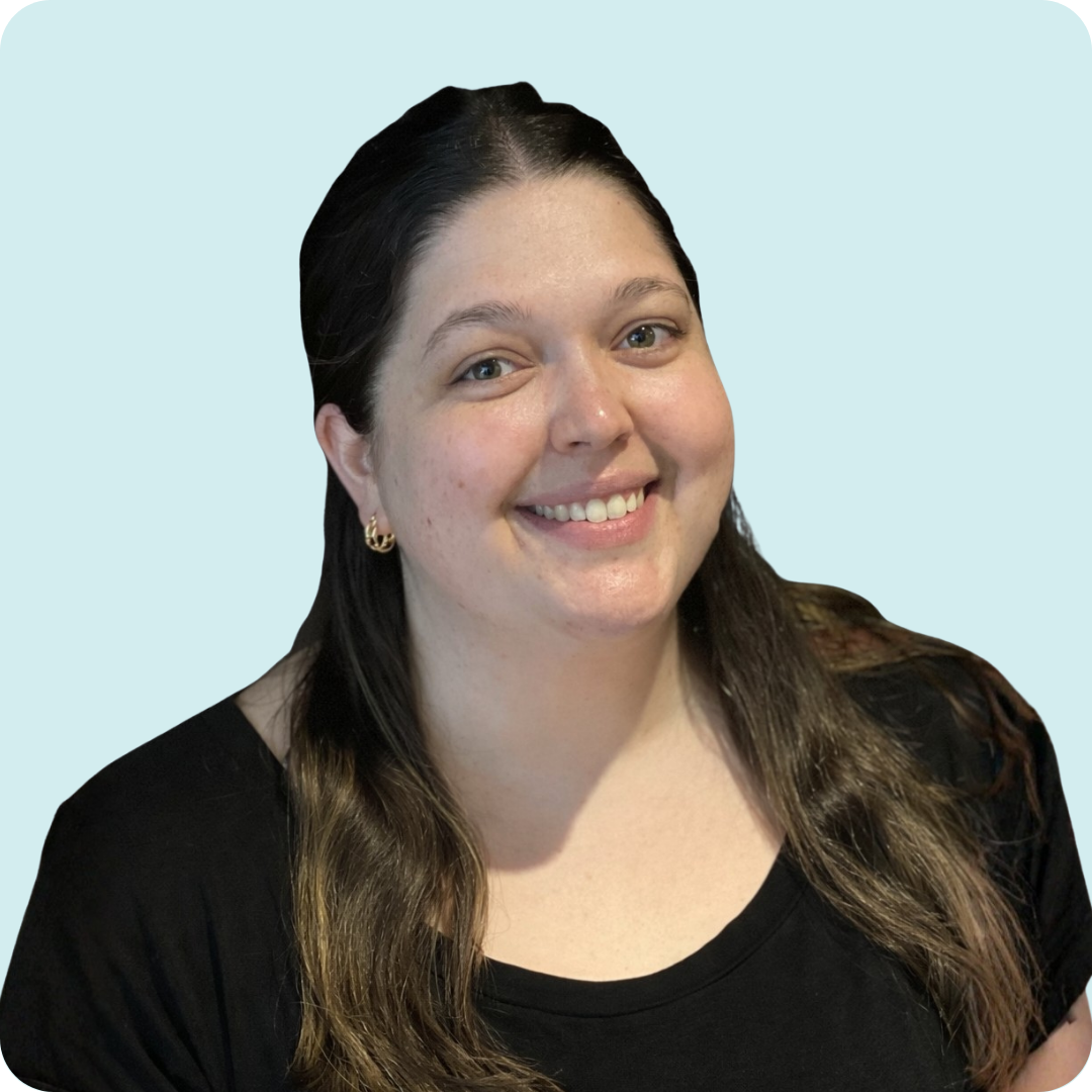 A woman in a black shirt is smiling.