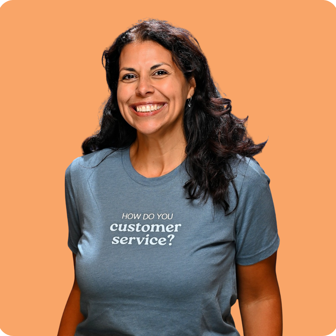 A woman in a blue shirt that says 
