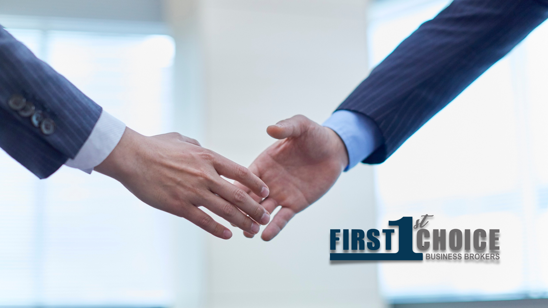 Two people shaking hands with the first choice logo in the background