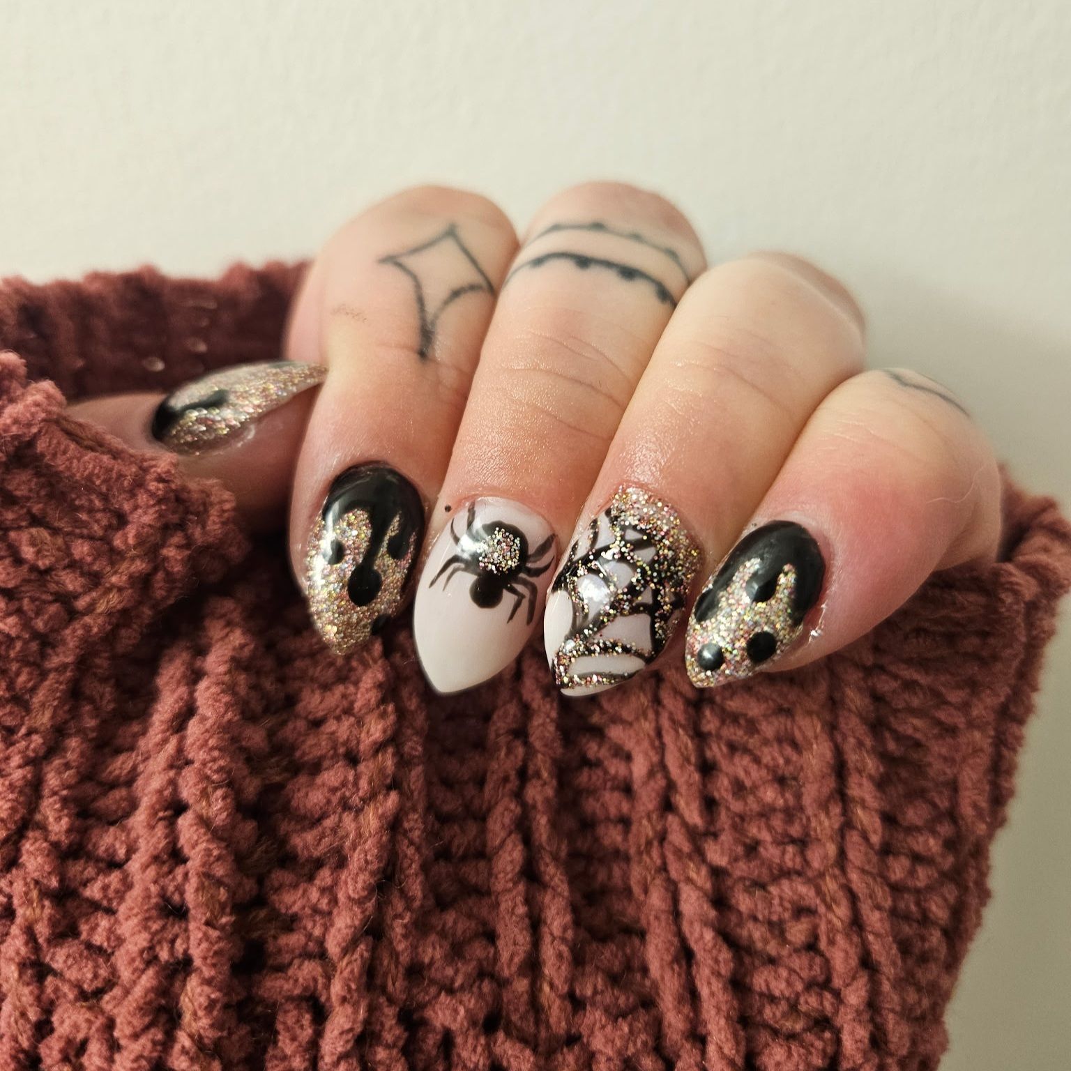 A close up of a woman 's feet with red nail polish and a ring.