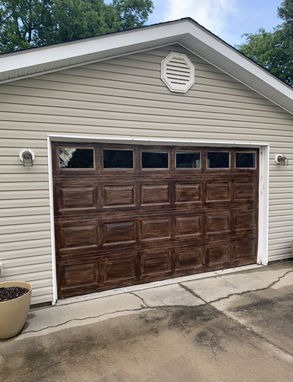 stained garage door with no decorative window inserts