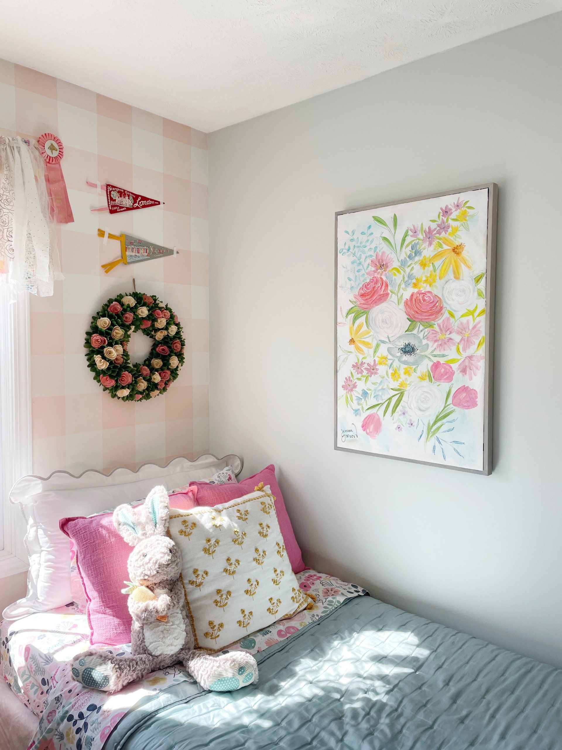 Large floral painting over little girl's bed