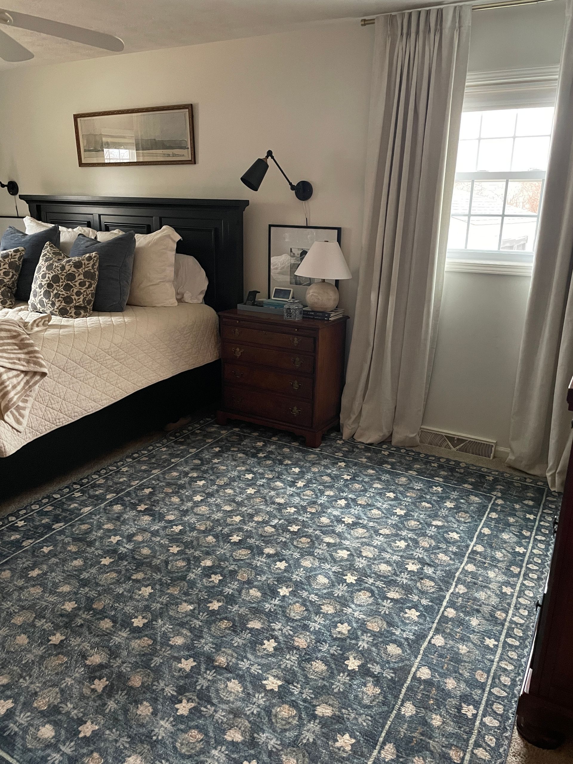 Navy floral rifle paper co rug in bedroom