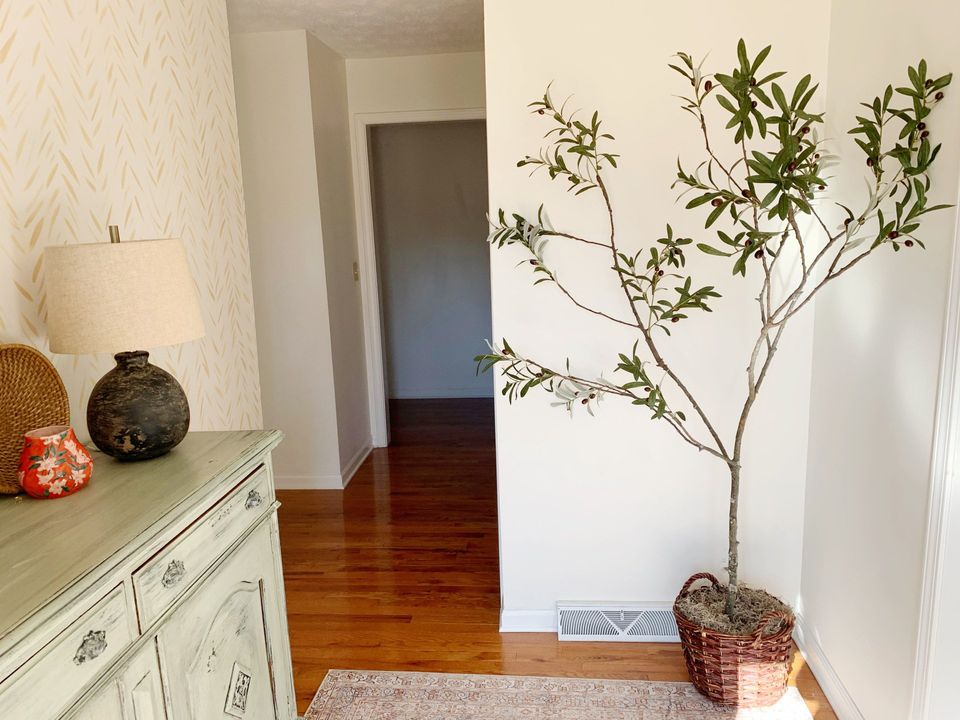faux olive tree in foyer