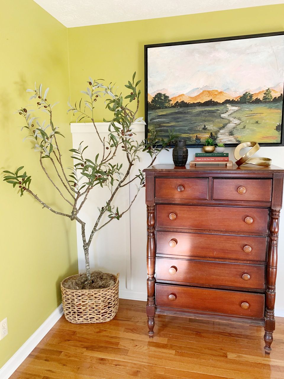 faux olive tree in dining room