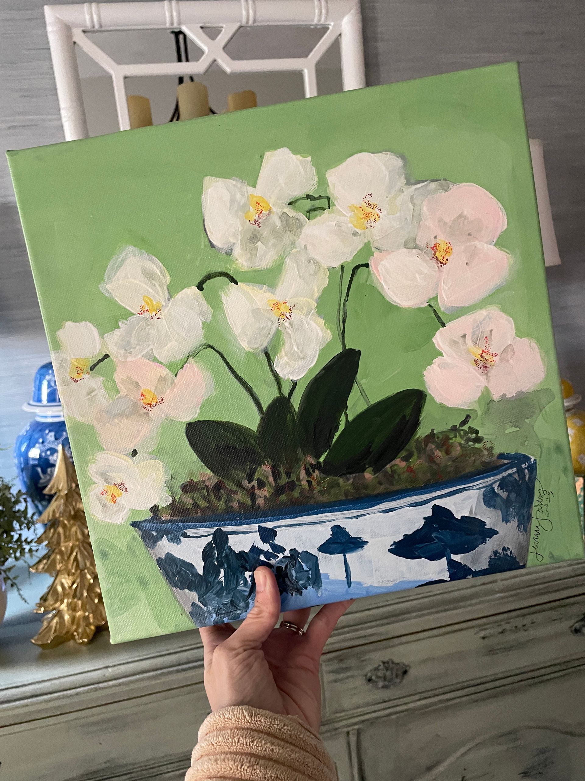acrylic painting of orchids in blue and white chinoiserie bowl with green background