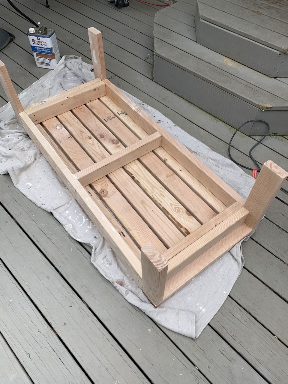 Sanding outdoor coffee table and sealing with Thompson's water seal and stain