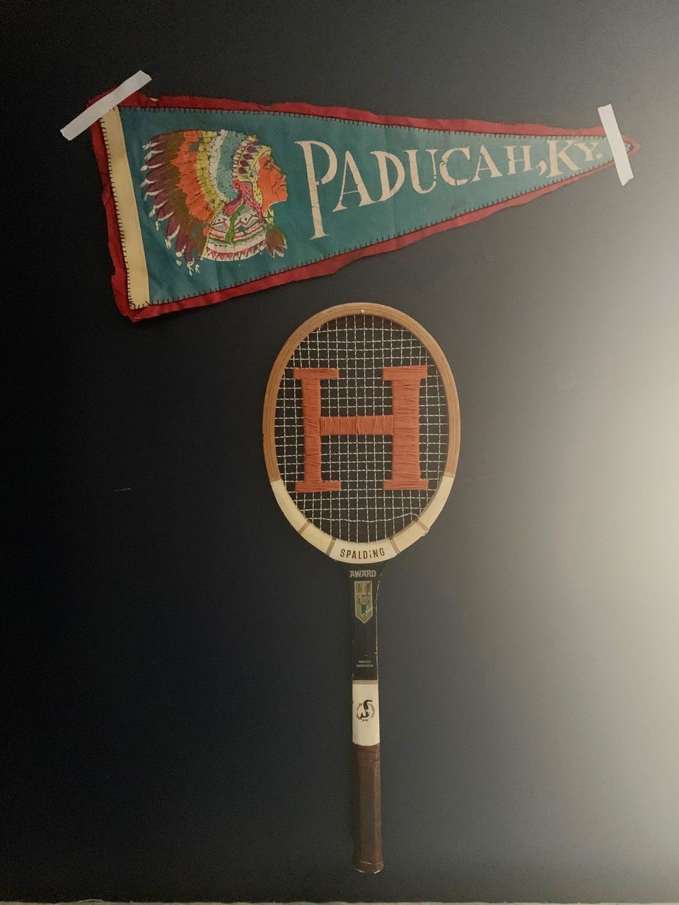 vintage racket and pennant decor for tween boys room