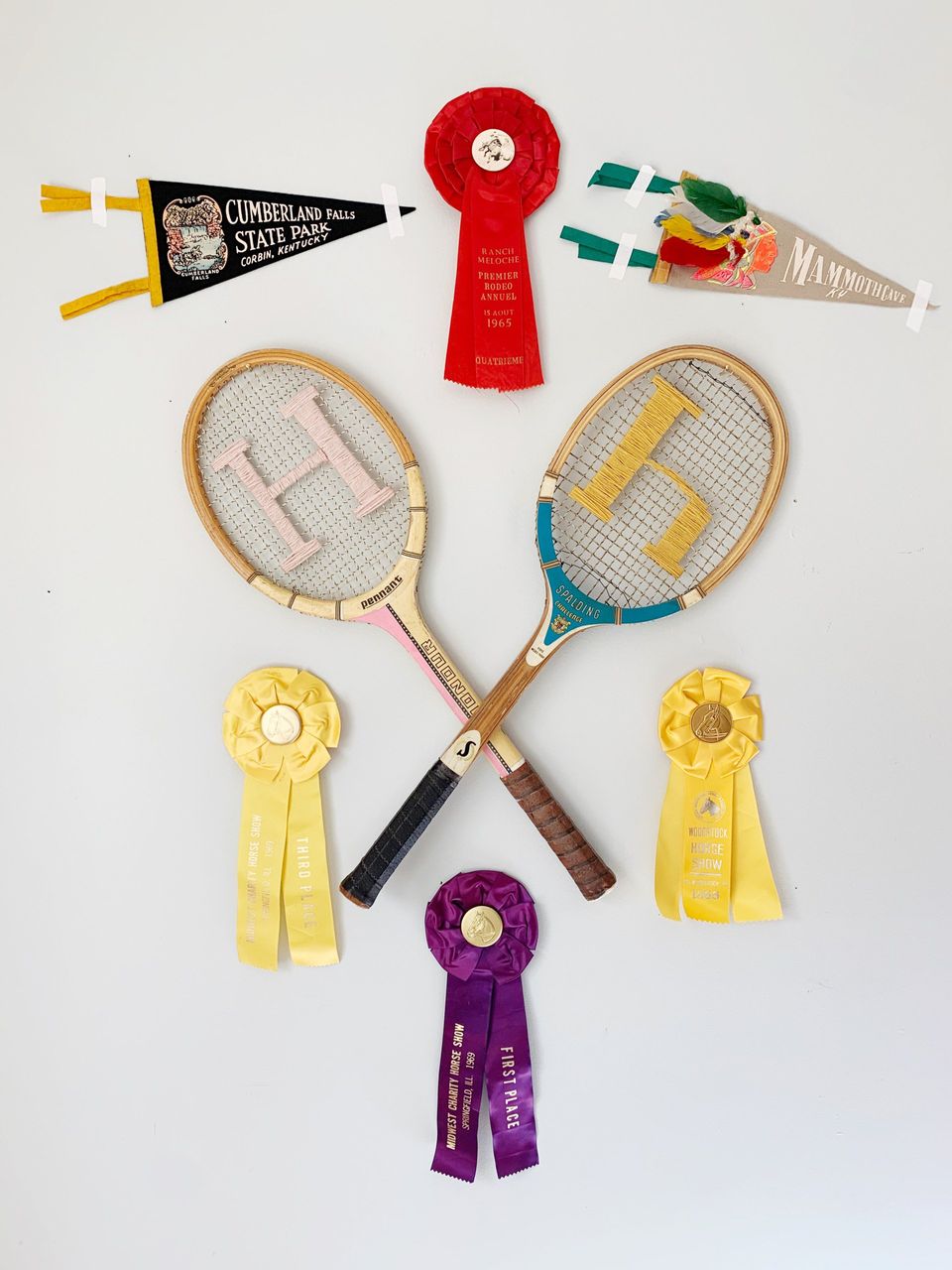 vintage horse show ribbons, pennants and vintage tennis rackets for wall decor