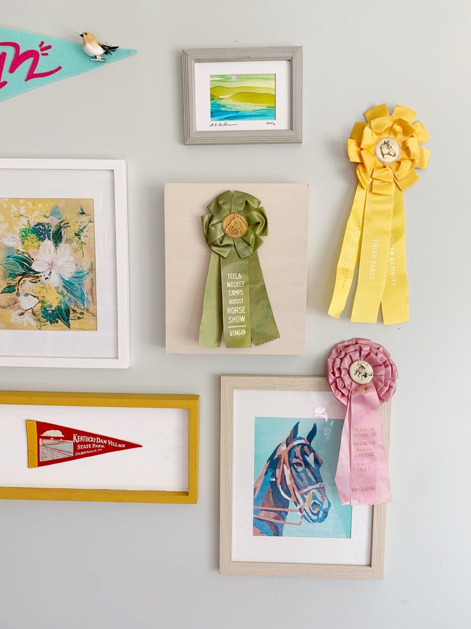 vintage horse show ribbons on gallery wall