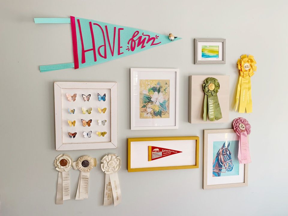 vintage horse show ribbons on gallery wall