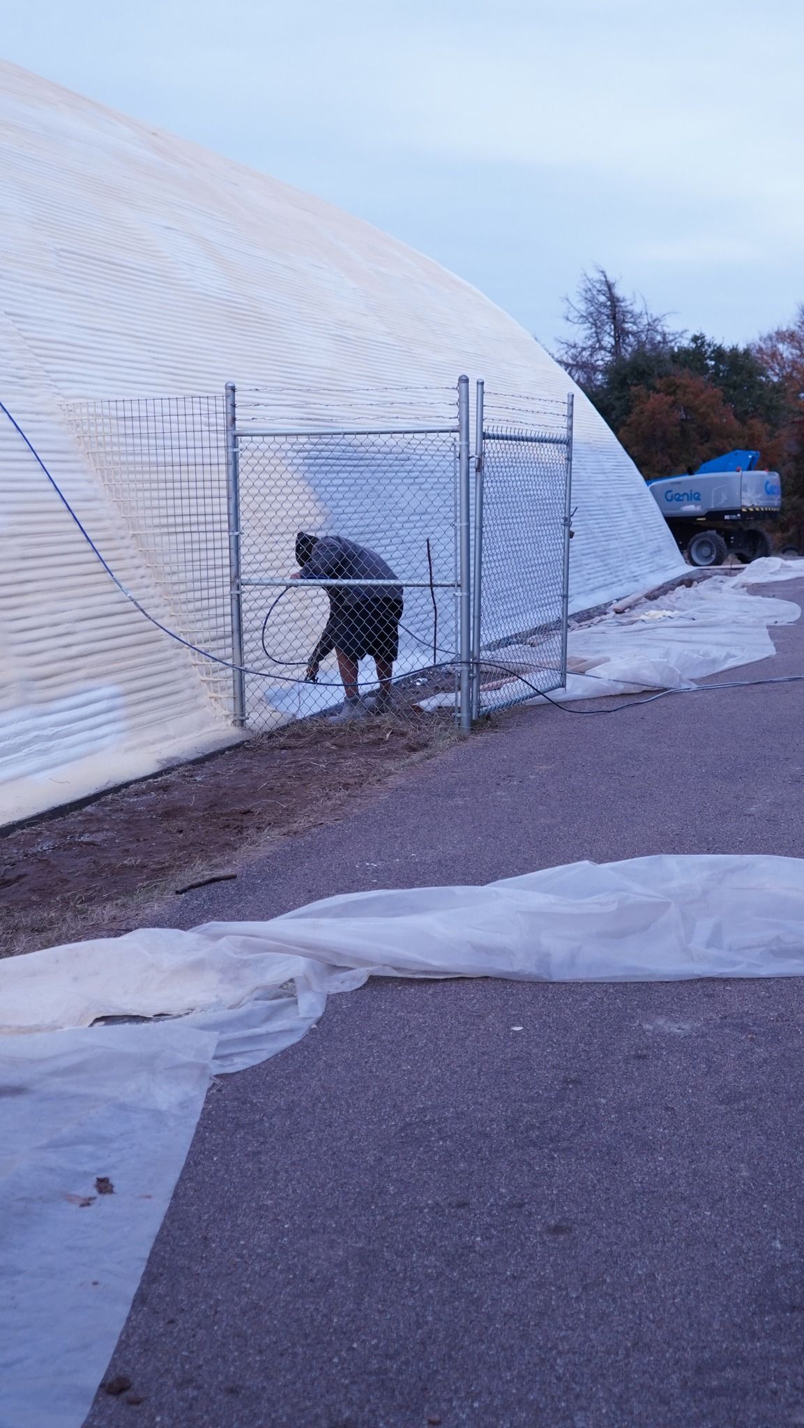 A man in a plaid shirt is using a laptop