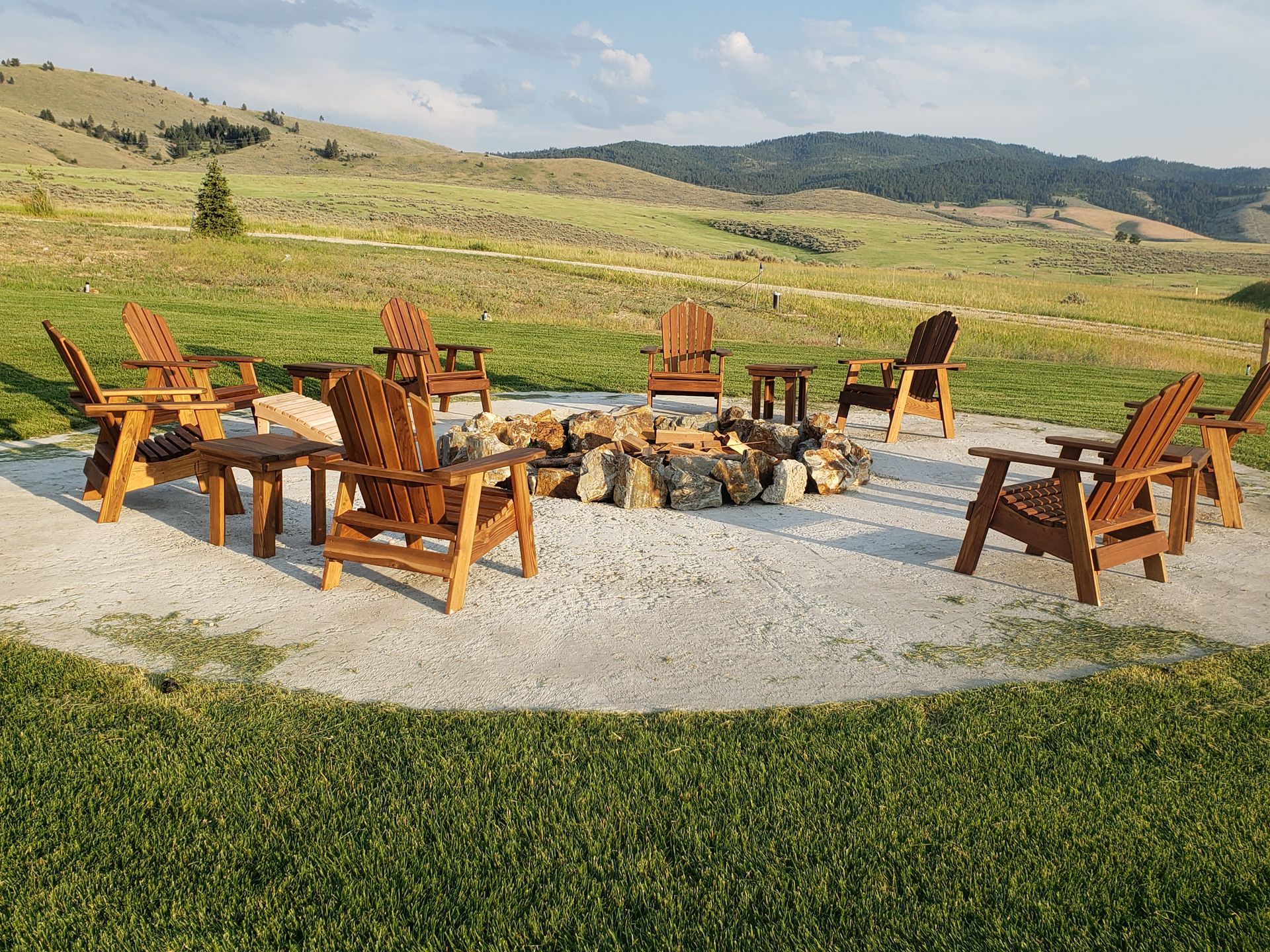 A patio with a table and chairs under an umbrella.