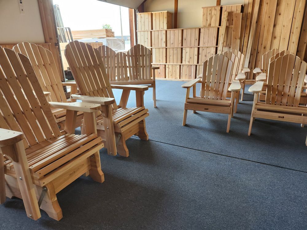 A group of wooden chairs are sitting in a room.