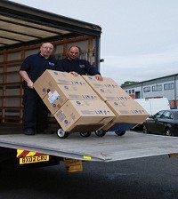 GTM Relocations removal team loading a van with boxes