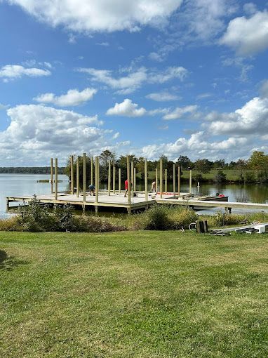 A dock is being built on the shore of a lake.