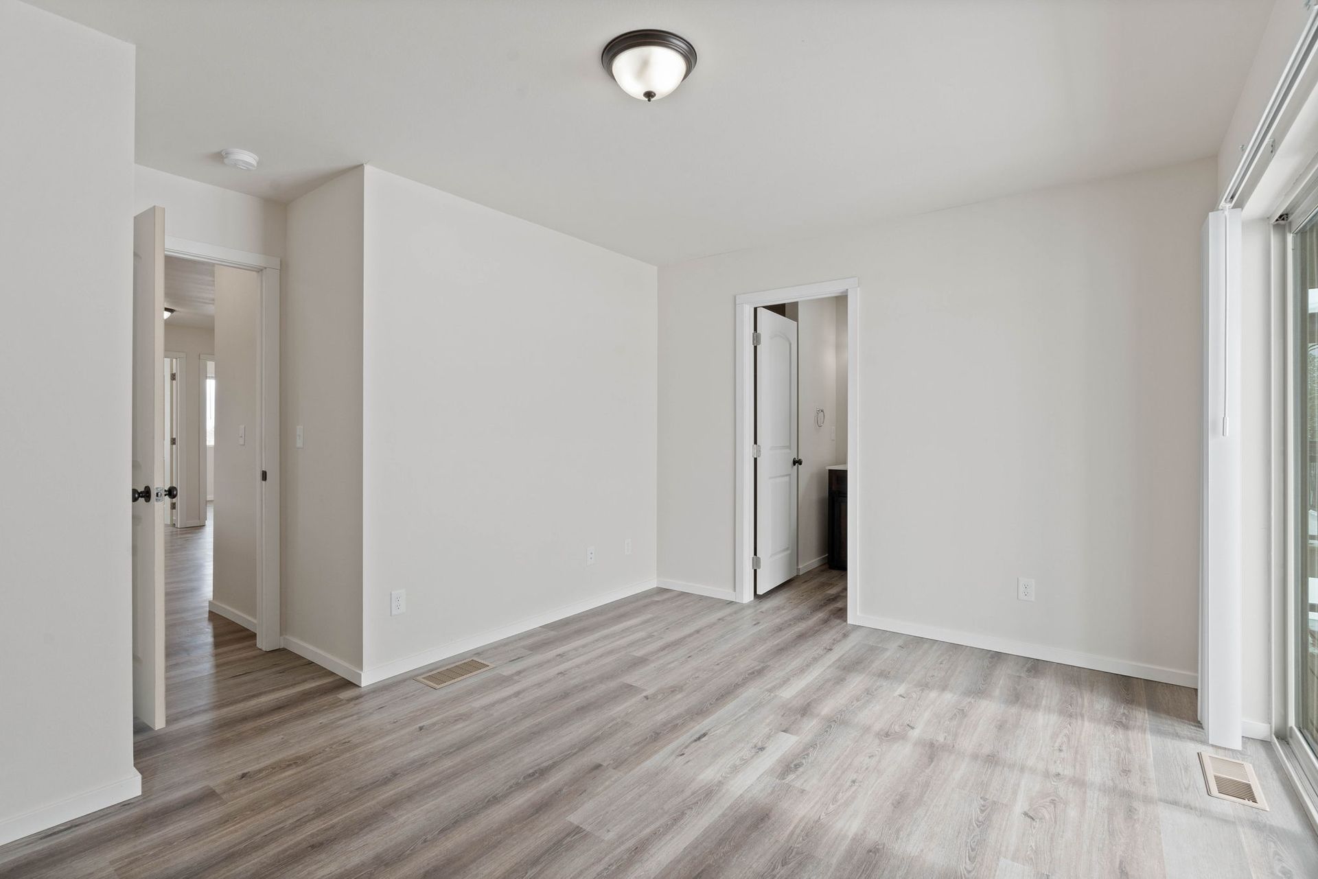 Winona Homes upstairs room with door