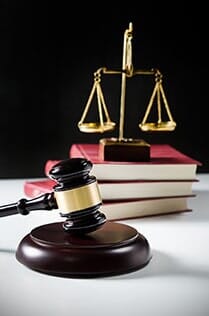 Wooden gavel and books on wooden table - Law Firm in Meadows, IL