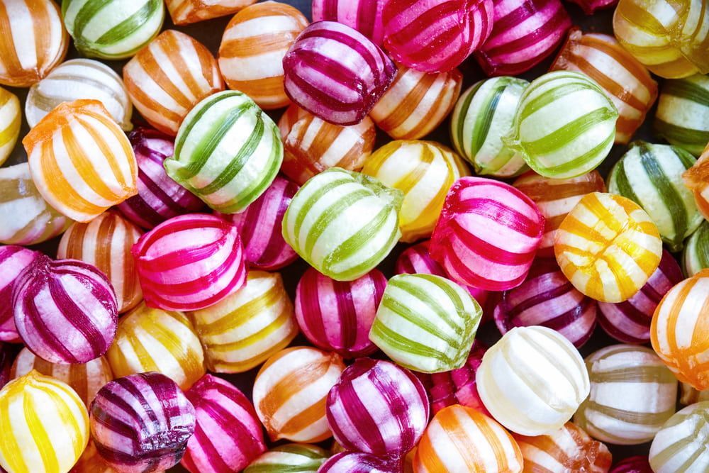 A Pile of Colourful Striped Candy Balls on A Table — Canberra Tobacconist in Dickson, ACT