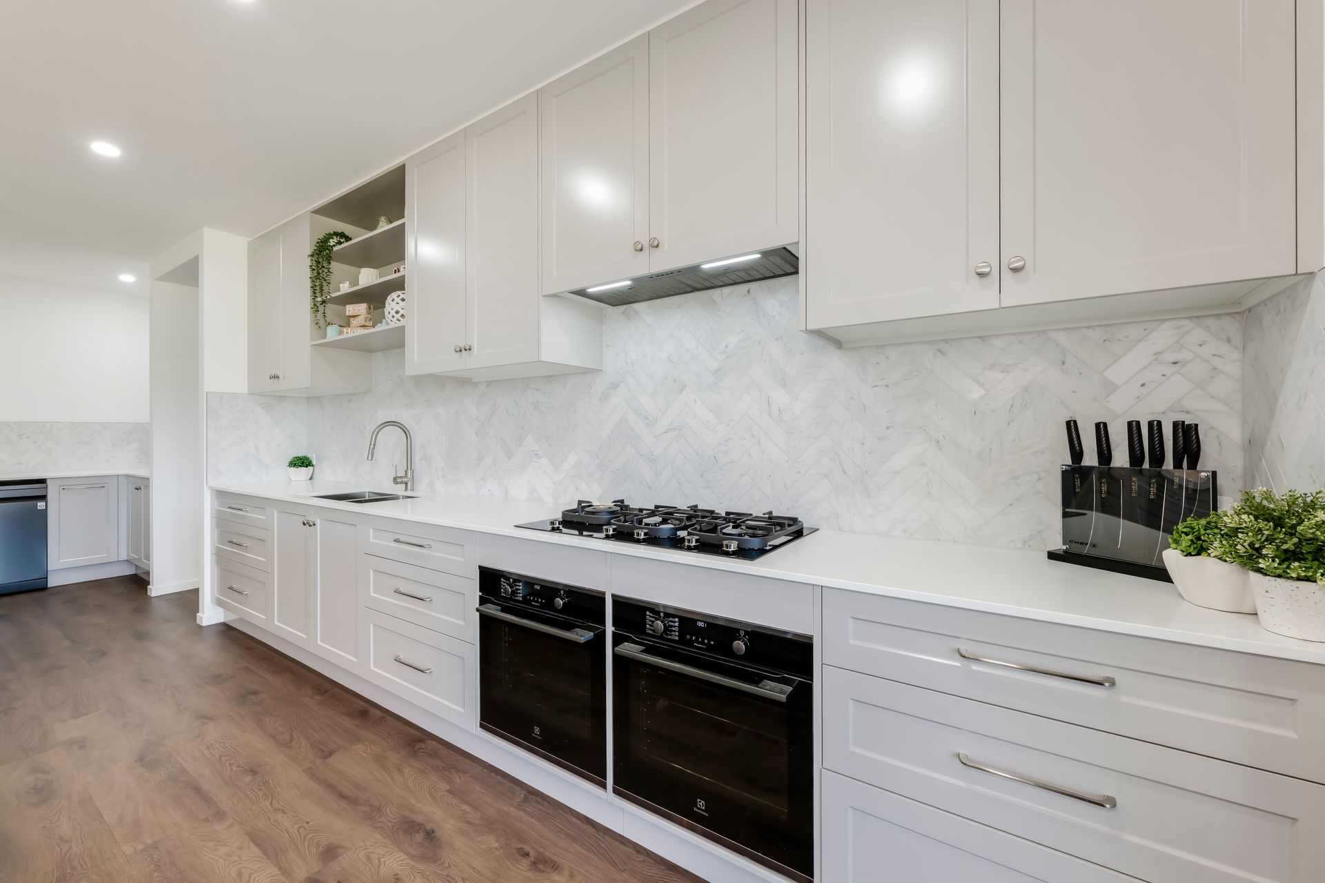 A Walk In Closet With Lots Of Shelves And Drawers — Master Cabinets Bundaberg in Kensington, QLD
