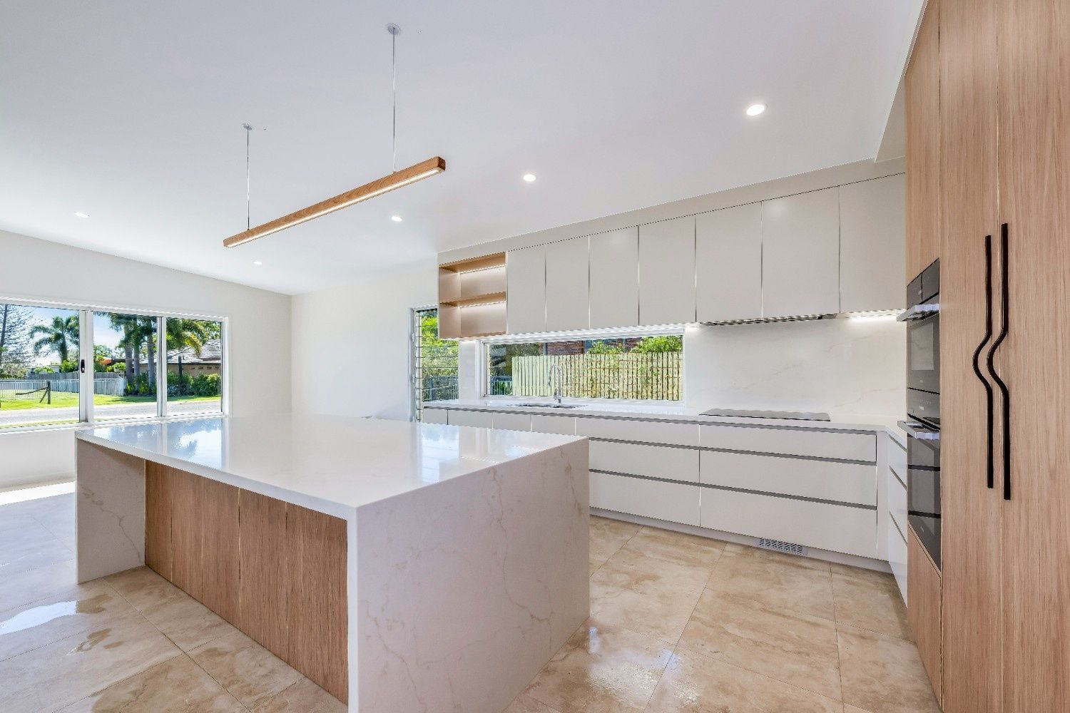 Bright Modern Kitchen With White Island — Master Cabinets Bundaberg in Kensington, QLD
