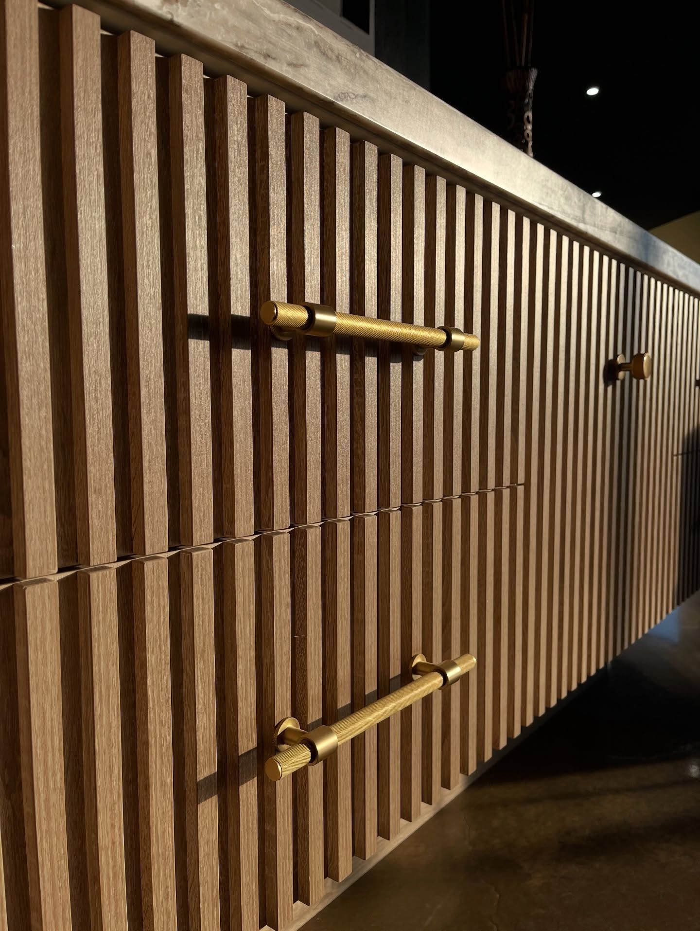Wooden Drawers With Vertical Slats and Gold Handles — Master Cabinets Bundaberg in Kensington, QLD