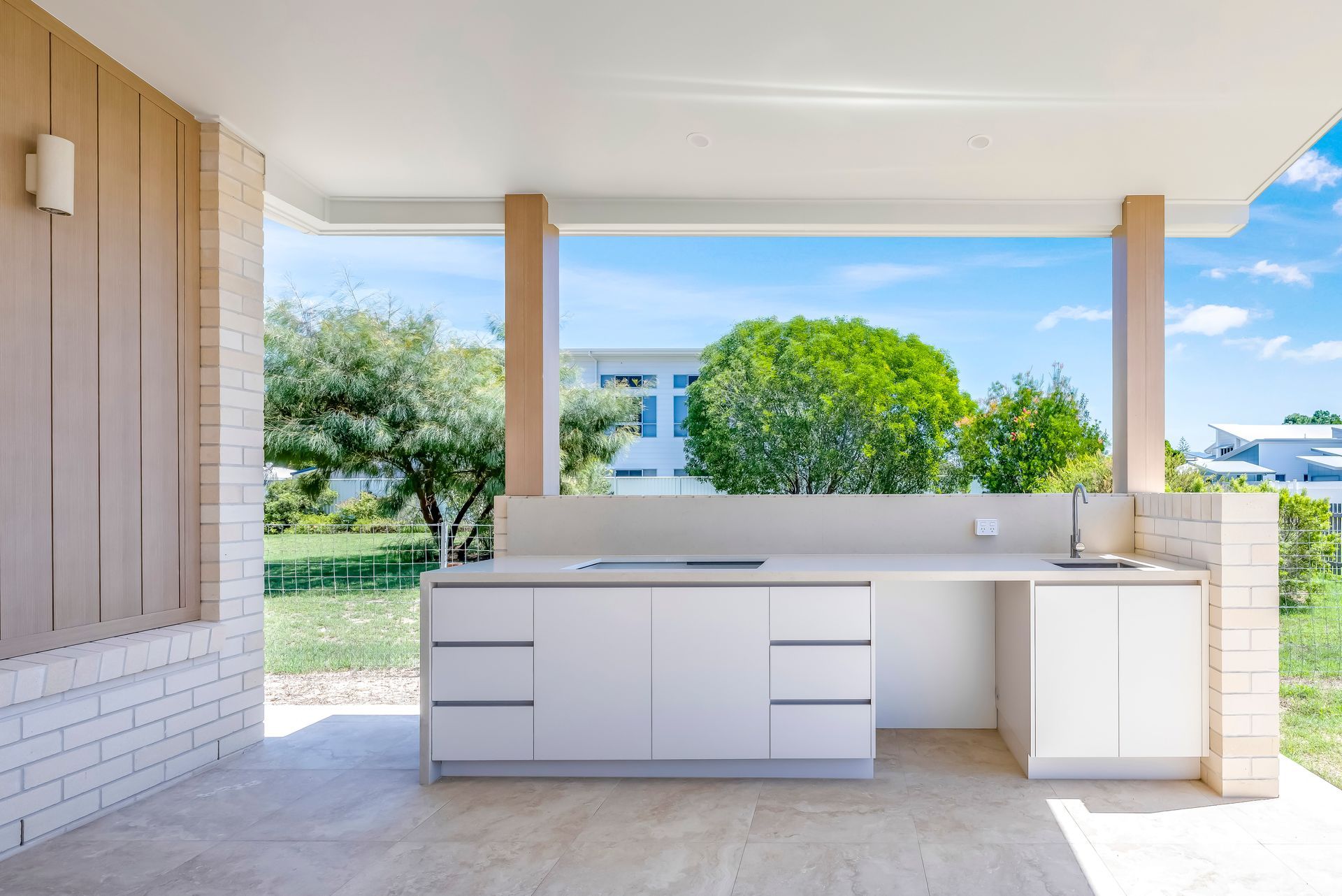 A Bathroom With Two Sinks And A Large Mirror — Master Cabinets Bundaberg in Kensington, QLD