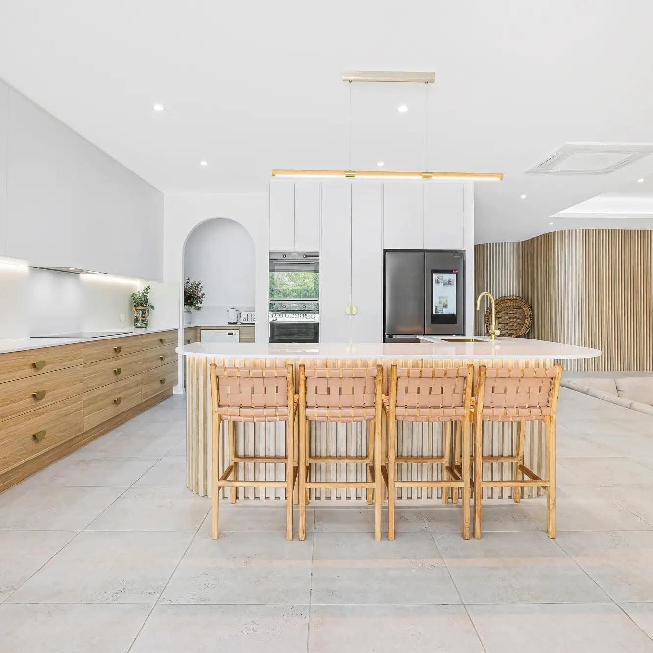 A White Wardrobe With The Doors Open In An Empty Room — Master Cabinets Bundaberg in Burrum Heads, QLD