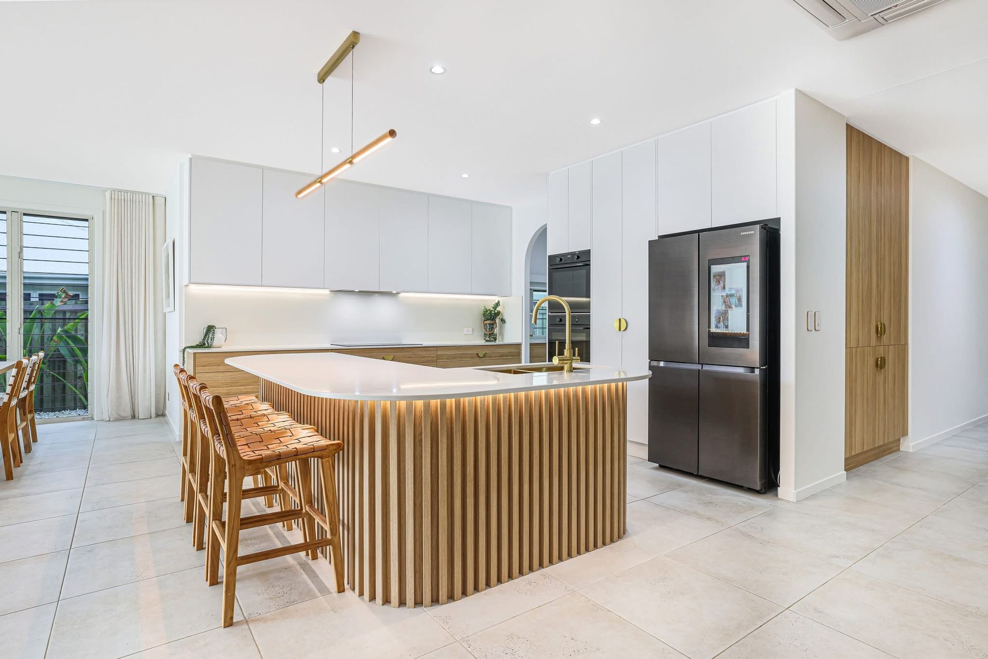 A Kitchen With White Cabinets And Shelves And A Vase On The Counter — Master Cabinets Bundaberg in Kensington, QLD